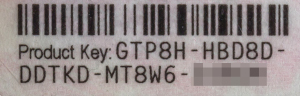 A picture of a Microsoft Proof of License Certificate of Authenticity.  It has a barcode on top and text on bottom that reads 'Product Key: GTP8H-HBD8D-DDTKD-MT8W6-', followed by five more letters that are blurred out.